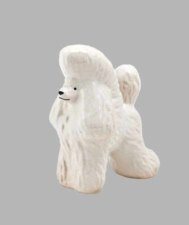 White porcelain poodle isolated on gray backgroundの写真素材