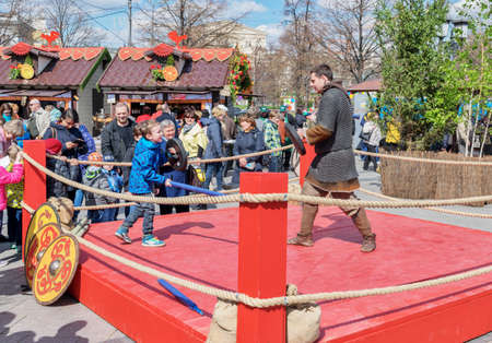 Moscow, Russia - April 24, 2016: Festival, named after Â «Moscow spring 2016Â». Ring at Revolution square. Children teaching skills of medieval combat on swords (the swords are safe and soft).のeditorial素材