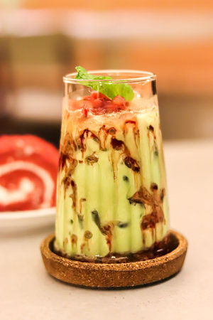 High-angle view of close-up of Juice with avocado on tableの写真素材