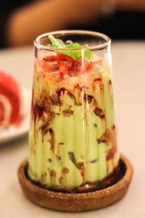 High-angle view of close-up of Juice with avocado on tableの写真素材