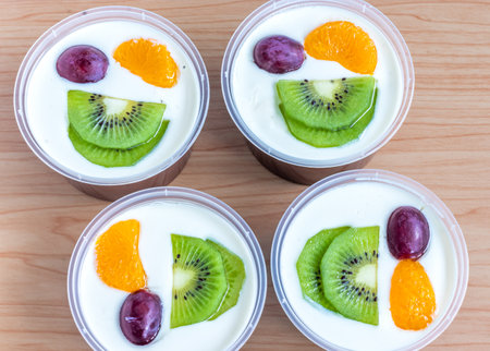Fruity milk pudding, sweet chocolate silk pudding dessert with fruit toppingの写真素材