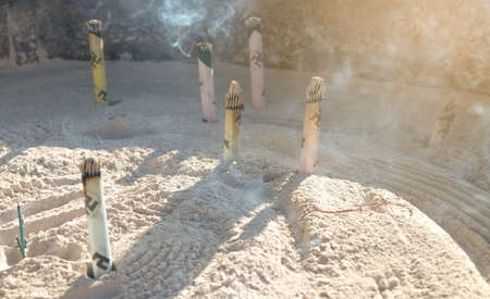 Smoke from many burning incense in giant incense burner,In front of famous Buddhist temple Senso-ji in Asakusa,Japanのeditorial素材