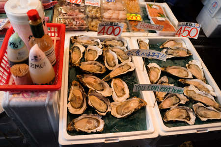 TSUKIJI Tokyo , Japan - November 13,2017 : Fresh oyster and sauces , sea shell ,Japan popular seafood.のeditorial素材