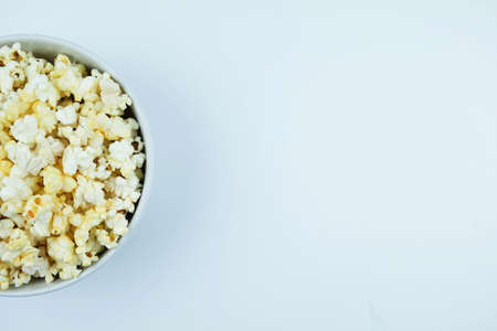 Flat lay of pop corn bowl on a white background,Top view