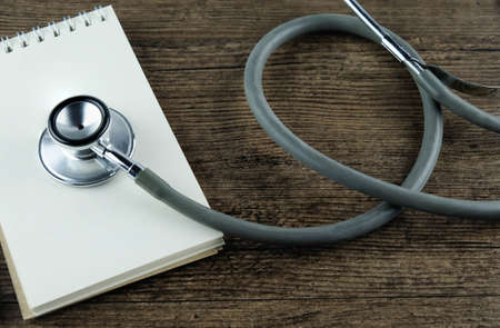 Close up of Stethoscope and blank notebook, Concept for Medical Education or health recording.の写真素材