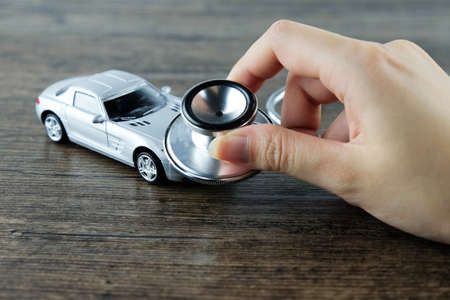 Stethoscope checking up the car, Concept of car check-up, repair and maintenance.