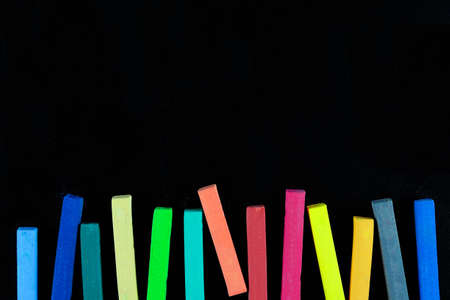 Colourful chalk pastel on black background, Concept of education background