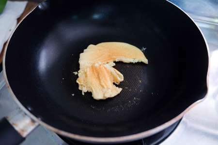 Making pancakes on frying pan , top view