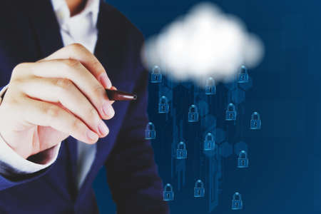 Businessman pointing a  cloud and lock icon.Cloud computing and network security concept