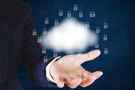 Businessman holding a  cloud and lock icon.Cloud computing and network security concept