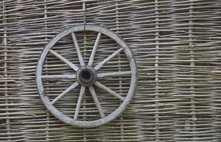 village  Wicker fence vine  wooden wagon wheelの写真素材