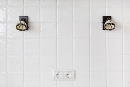 kitchen, a fragment of a wall of white tiles, sconceの写真素材