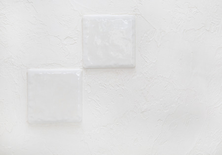 fragment white textured wall. close-up of ceramic tilesの写真素材