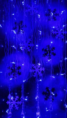 fragment of blue Christmas night window. new year celebration