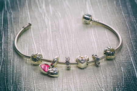 Women's Bracelet Pandora, Charms close-up, jewelry, retro styleの写真素材