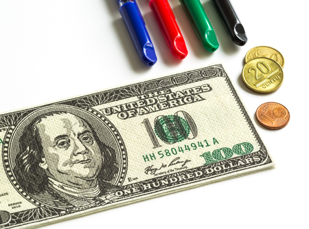 coins, currency notes; pens close-up on a white background, money, currency, businessの写真素材