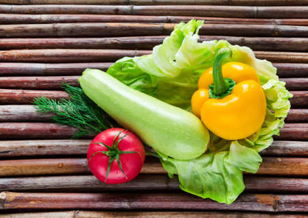 Healthy food from village. Eco food concept. Fresh organic vegetables on wood table in the garden.の写真素材