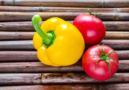 Healthy food from village. Eco food concept.  Fresh organic vegetables on wood table in the garden.の写真素材
