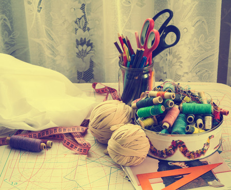 Sewing supplies and accessories on the table, tool, craft, old photo, retro styleの写真素材