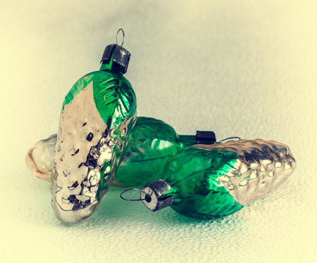 Old-fashioned Christmas tree decorations: cones, glassの写真素材
