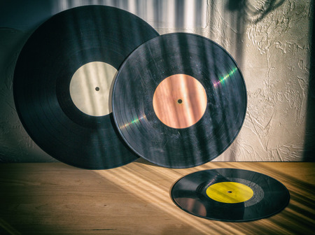 Black Vinyl Close-up of old records on a wooden table, retro, vintage itemsの写真素材