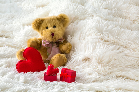 Romantic decoration with red hearts on bed, Beautiful interior for valentines day, birthday, wedding or surprise conceptの写真素材
