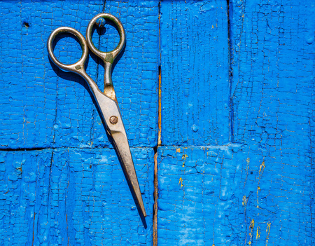 texture of the old wood with natural pattern and scissors, blue, color, background, retro styleの写真素材