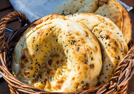 Homemade baked pita bread in a basket close-up, selective focusの写真素材