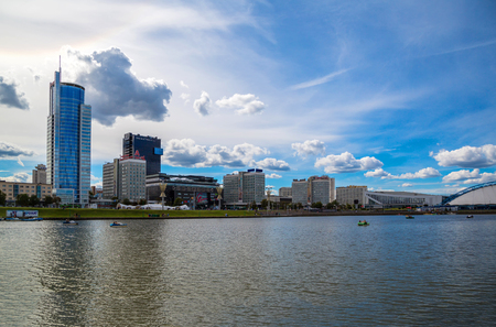 Belarus, Minsk, Jul 15, 2017. View of the city of Minsk on the Pobediteley Avenue from the embankment of the Svisloch in the background of the Royal Plaza business center and the Minsk-Mobil MALL GALLERY, editorialのeditorial素材