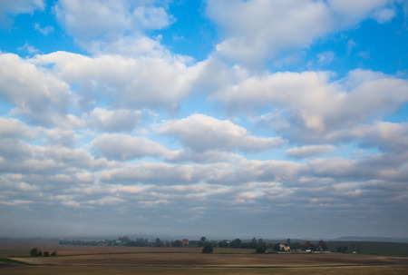 rural landscape and field against the blue sky with beautiful clouds, beauty of nature, Belarusの写真素材