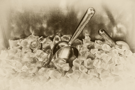 Metal scoop with ice cubes for cocktails, close-up, retro style, black and white, toningの写真素材