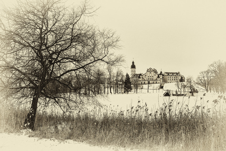 Belarusian attraction Nesvizh castle covered with snow in the winter season. retro styleのeditorial素材