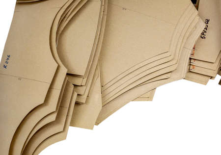Cardboard patterns for sewing. Industrial production of clothing. A large number of paper sewing...