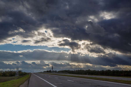 Heavenly landscape of blue dramatic sky. Asphalt road. Scene of a colorful sky view. Cloudy sky landscape. Heavenly background.の写真素材