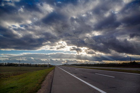 Heavenly landscape of blue dramatic sky. Asphalt road. Scene of a colorful sky view. Cloudy sky landscape. Heavenly background.の写真素材