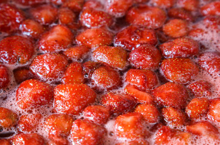 Making homemade strawberry jam. Boiling strawberry jam close-up. Red sweet syrup. Soft Focus, Close...