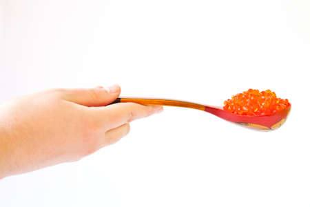 Spoon full of red caviarの写真素材