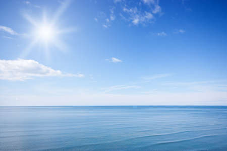 Sunny blue sky and ocean, natural wallpaperの写真素材