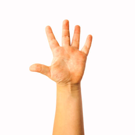 Child raised hand photo isolated on whie backgroundの写真素材