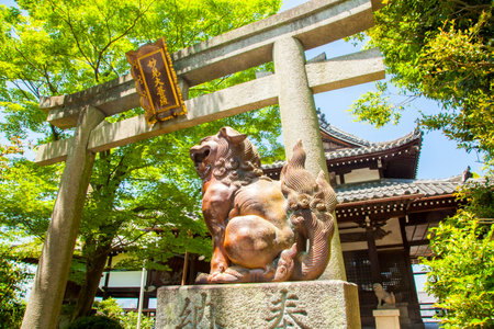 Torii - traditional Japanese gate in Kumano Shrine, Kyoto (text on tablet Kumano Shrine)