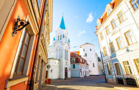 Pils iela street and Our Lady of Sorrows Church in Riga, Latviaの写真素材