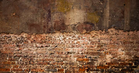 Old broken brick wall, wide photo for your designの写真素材