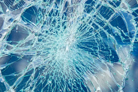 Broken glass texture, window cracks backgroundの写真素材
