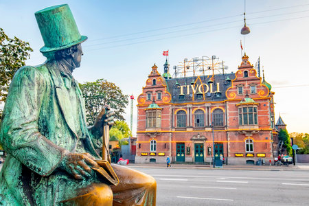 Copenhagen, Denmark - June 19, 2020: Hans Christian Andersen sculpture and entrance to Tivoli Garden park, one of the oldest operating amusement parks in the world.のeditorial素材