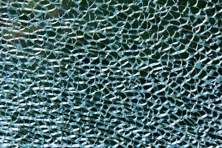 Broken glass texture with cracks, abstract patternの写真素材