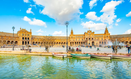 Sevilla, Spain â 15 March, 2021: Spanish Square (La Plaza de Espana) and water canal scenic viewのeditorial素材
