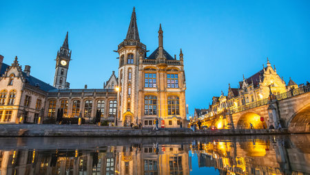 Ghent, Belgium - 29 April, 2022: Old town night skyline and Leie river panoramaのeditorial素材