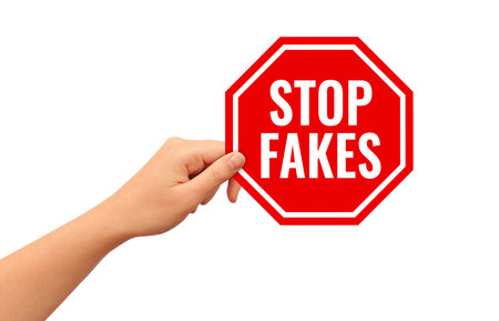 Stop fakes sign isolated on white backgroundの写真素材