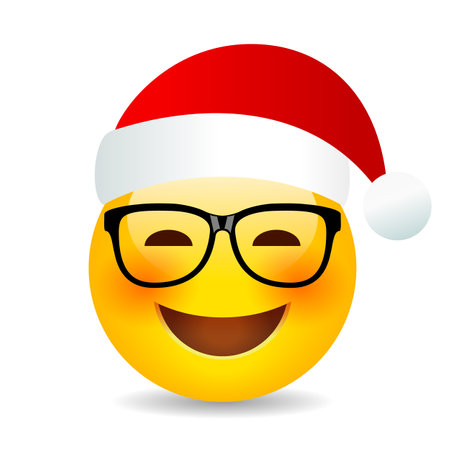 Christmas smiling emoji with red Santa cap, vector cartoon on white backgroundのイラスト素材