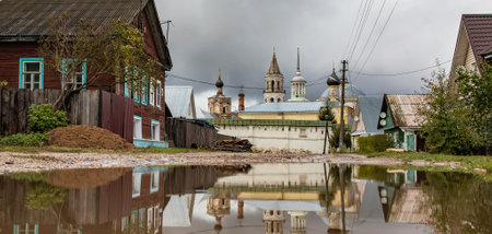 Russian rural landscape, scenic village with old churchesの写真素材